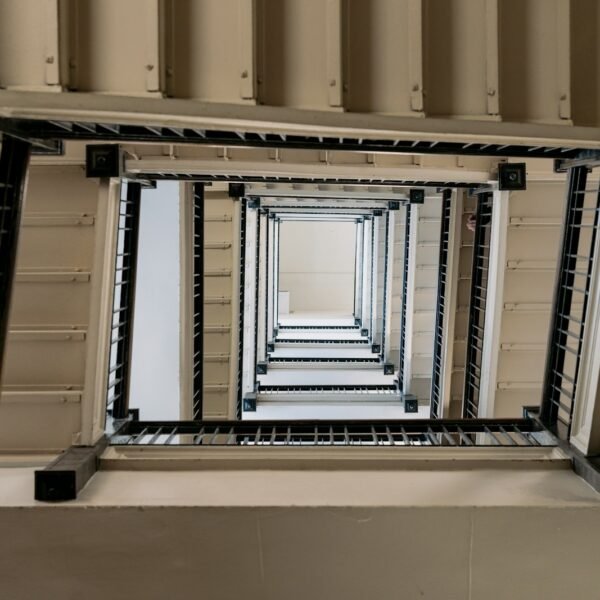 Looking down an endless rectangular staircase.